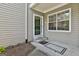 Close-up of the entrance showcasing the front door, siding, and landscaping at 508 Las Brasis Ct, Peachtree City, GA 30269