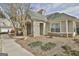 Front entrance with stone details, landscaping, and sidewalk at 508 Las Brasis Ct, Peachtree City, GA 30269