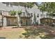 Back of the building includes patios and balconies overlooking the yard at 508 Las Brasis Ct, Peachtree City, GA 30269