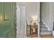 Inviting foyer with staircase and view into a nearby half bath at 508 Las Brasis Ct, Peachtree City, GA 30269