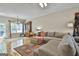 Spacious living room with hardwood floors, a ceiling fan, natural light, and comfortable seating at 508 Las Brasis Ct, Peachtree City, GA 30269