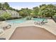 View of the community pool, tanning chairs, and a hot tub at 508 Las Brasis Ct, Peachtree City, GA 30269