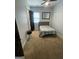 Cozy bedroom showcasing a single bed, carpeted floor, and neutral decor, creating a serene atmosphere at 1333 Happy Hill Rd, Carrollton, GA 30116
