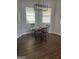 This dining room features hardwood floors, neutral paint, and natural lighting at 1333 Happy Hill Rd, Carrollton, GA 30116