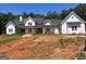 Charming new construction home with a white exterior and a covered front porch at 1333 Happy Hill Rd, Carrollton, GA 30116