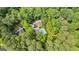 Aerial view of home featuring a swimming pool and extensive tree cover at 210 Farr Lake Dr, Tyrone, GA 30290
