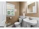 Cozy half-bathroom with classic fixtures, and tiled flooring for a modern design at 210 Farr Lake Dr, Tyrone, GA 30290