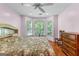 Cozy bedroom with a bay window offering a serene outdoor view at 210 Farr Lake Dr, Tyrone, GA 30290
