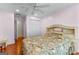 Cozy bedroom features hardwood floors, ceiling fan, and a double-door closet at 210 Farr Lake Dr, Tyrone, GA 30290