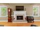 Elegant fireplace with white mantle, tile surround and traditional grandfather clock at 210 Farr Lake Dr, Tyrone, GA 30290