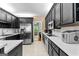 Well-designed kitchen with black cabinets, white countertops, and stainless appliances at 210 Farr Lake Dr, Tyrone, GA 30290