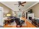 Spacious living room with hardwood floors, fireplace and comfortable seating at 210 Farr Lake Dr, Tyrone, GA 30290