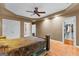 Comfortable bedroom with a walk-in closet, ceiling fan and ensuite bathroom at 210 Farr Lake Dr, Tyrone, GA 30290