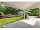 Covered patio offers a view of the landscaped backyard and inviting swimming pool at 210 Farr Lake Dr, Tyrone, GA 30290