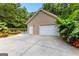 Exterior of the detached pool house with garage door and a view of the pool at 210 Farr Lake Dr, Tyrone, GA 30290