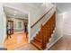 Elegant entryway with wooden staircase and hardwood floors at 210 Farr Lake Dr, Tyrone, GA 30290