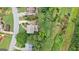 An aerial view showcasing the home, its well-maintained yard, mature trees, and surrounding neighborhood at 405 Woodbrook Way, Lawrenceville, GA 30043