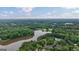 Expansive aerial view of the lake community, featuring lush greenery and beautiful waterfront homes at 405 Woodbrook Way, Lawrenceville, GA 30043