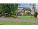 Expansive backyard featuring a well-maintained lawn, mature trees, and a charming fenced perimeter at 405 Woodbrook Way, Lawrenceville, GA 30043