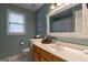 Bathroom showcasing a vanity sink, and decorative mirror at 405 Woodbrook Way, Lawrenceville, GA 30043