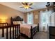Bedroom featuring a full sized bed, crib, and natural light at 405 Woodbrook Way, Lawrenceville, GA 30043