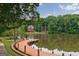 Picturesque waterfront home with private dock access and views of the serene lake at 405 Woodbrook Way, Lawrenceville, GA 30043