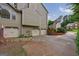 Spacious driveway with a three-car garage and landscaped surroundings, offering ample parking at 405 Woodbrook Way, Lawrenceville, GA 30043