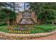Stone sign with a water feature at the entrance to Edgewater by John Wieland Homes at 405 Woodbrook Way, Lawrenceville, GA 30043