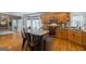 Kitchen featuring wood cabinets, stainless steel appliances, granite counters and seating at island at 405 Woodbrook Way, Lawrenceville, GA 30043