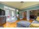 Living room with hardwood floors, french doors leading to outdoor patio, and open floor plan at 405 Woodbrook Way, Lawrenceville, GA 30043