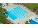 Aerial view of a large community pool with ample lounge seating, sun umbrellas and area at 405 Woodbrook Way, Lawrenceville, GA 30043