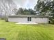 Expansive backyard with a patio and freshly cut green grass at 3948 Regent St, Douglasville, GA 30134