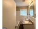 Bathroom features a tub, vanity, and a window that offers natural light at 3948 Regent St, Douglasville, GA 30134
