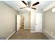 Bedroom featuring neutral walls, plush carpeting, ceiling fan, and closet at 3948 Regent St, Douglasville, GA 30134