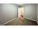 Inviting bedroom with neutral walls, plush carpeting and convenient closet at 3948 Regent St, Douglasville, GA 30134