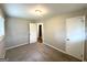 A cozy bedroom with neutral walls, plush carpeting, and a convenient closet at 3948 Regent St, Douglasville, GA 30134
