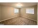 Cozy bedroom with carpeted floors, two windows, and neutral wall color at 3948 Regent St, Douglasville, GA 30134