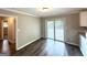 Cozy dining area with wood-look floors and sliding glass doors to the outside at 3948 Regent St, Douglasville, GA 30134