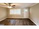 Bright living room featuring wood-look floors, a large window, and neutral wall color at 3948 Regent St, Douglasville, GA 30134