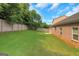 A spacious backyard features a privacy fence and lush green lawn at 1243 Polk Xing, Mcdonough, GA 30252