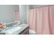 Bathroom shows a light granite vanity with a silver faucet and a decorative mirror in a neutral space at 1243 Polk Xing, Mcdonough, GA 30252