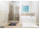 Bathroom with walk-in tiled shower and a soaking tub with tile surround at 1243 Polk Xing, Mcdonough, GA 30252