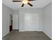 A large closet and doorway are visible in this bedroom with a ceiling fan at 1243 Polk Xing, Mcdonough, GA 30252