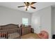 A crib, changing table, and chair make this bedroom perfect for a  at 1243 Polk Xing, Mcdonough, GA 30252