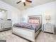 Cozy bedroom featuring neutral walls, carpeted floors, and a ceiling fan at 1243 Polk Xing, Mcdonough, GA 30252