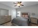 Comfortable bedroom featuring a decorative mirror and dresser with stylish decor at 1243 Polk Xing, Mcdonough, GA 30252
