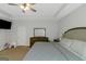 This lovely bedroom has a large bed, ceiling fan, and neutral tones to offer a relaxing atmosphere at 1243 Polk Xing, Mcdonough, GA 30252