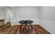 Formal dining room featuring modern trim, a round table, and hardwood flooring at 1243 Polk Xing, Mcdonough, GA 30252