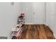 Hallway with shoe rack, hardwood floors and a closet at 1243 Polk Xing, Mcdonough, GA 30252
