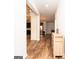 Inviting entryway with gleaming wood floors and an open view into the home's living spaces at 1243 Polk Xing, Mcdonough, GA 30252